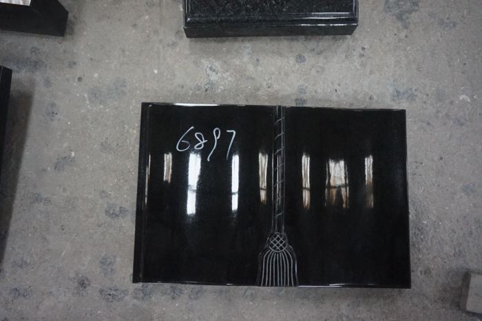 Open book headstones for graves